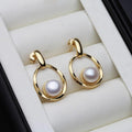 Elegant earrings made of gold and pearls