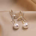 Gold Pearl Earrings with Shiny Bow